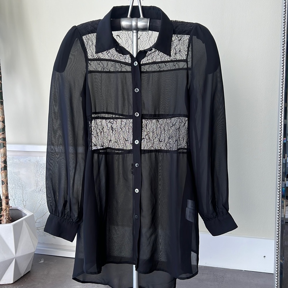 Play it up or down. Sheer blouse with lace pieces. International piece.